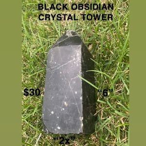 Polished Black obsidian crystal point